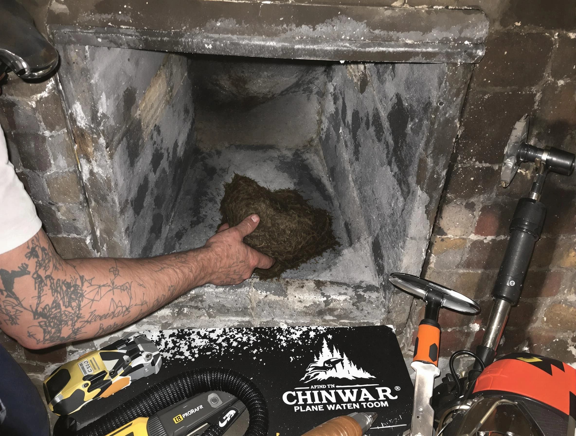Manalapan Chimney Sweep safely removing debris and screening chimney in Manalapan, NJ